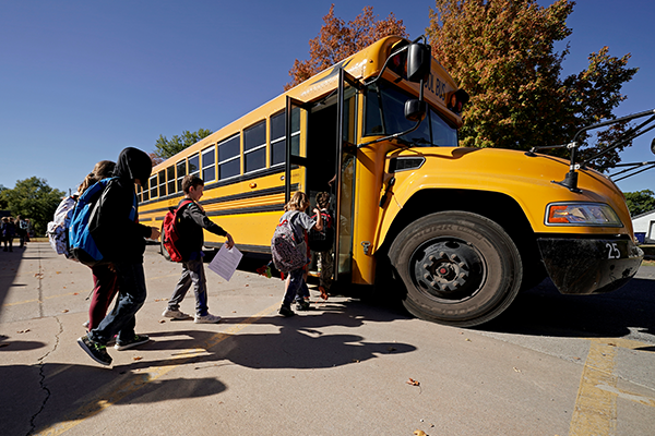 A white bus parked along a scenic road in Virginia