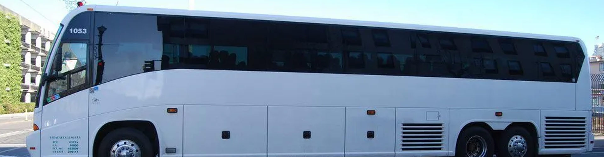 a white bus parked along a roadside in Virginia