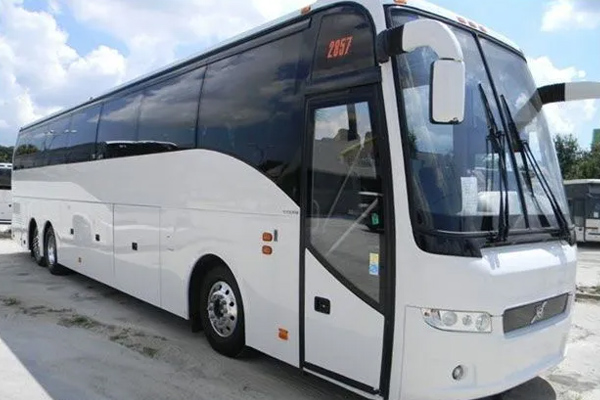 A white bus parked along a road in Washington, DC