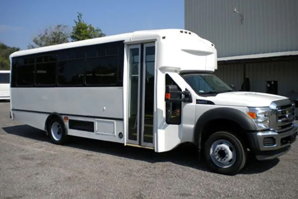 A white and black truck parked for employee shuttle services