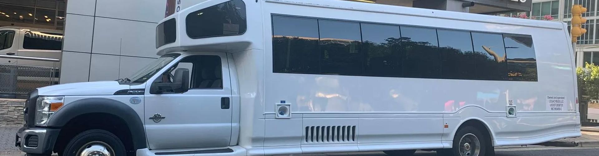 A white bus with large windows for scenic city tours