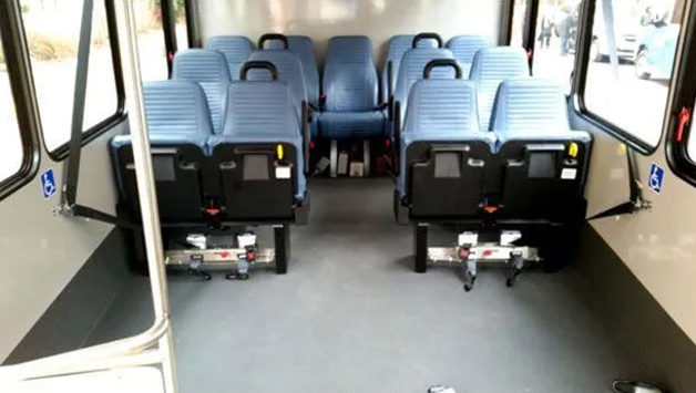 A row of seats on a bus for airport shuttles