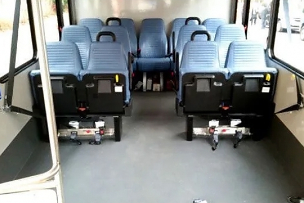 A row of seats on a bus for airport shuttles