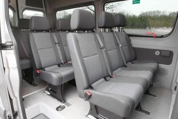 A white van with premium seating for corporate transportation