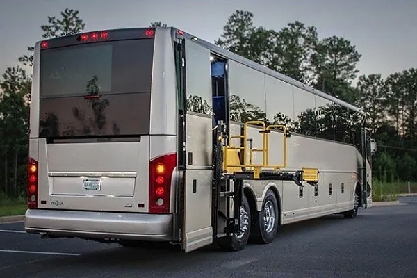 A large white truck driving through downtown for special events