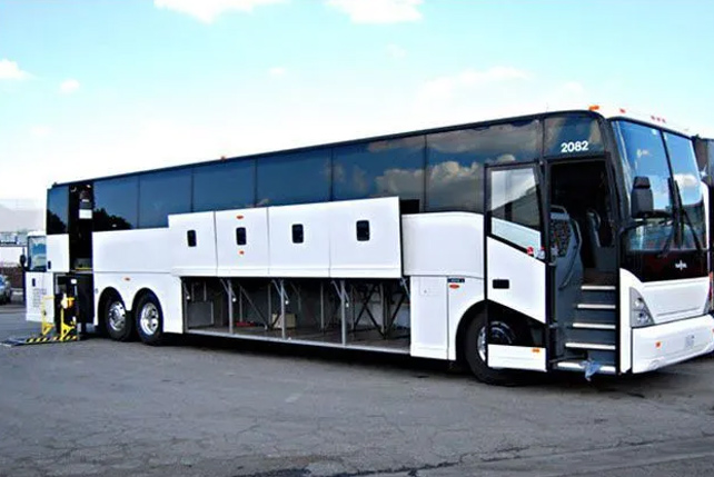 A spacious white bus in a Maryland parking lot for charters