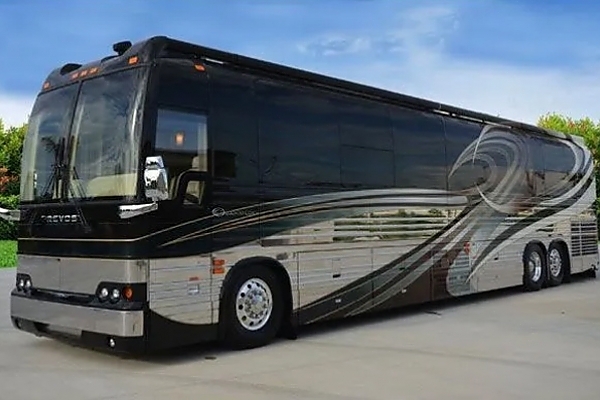 A large white bus parked in a lot for corporate travel in Washington, DC