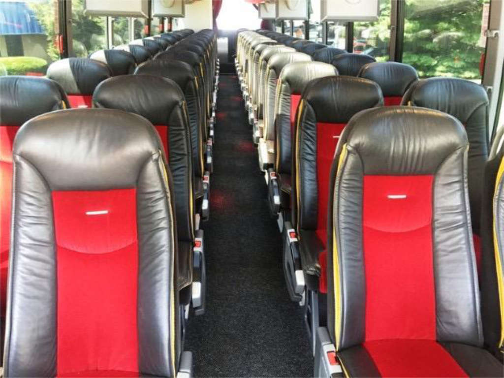 A row of seats with different colors on a minibus rental