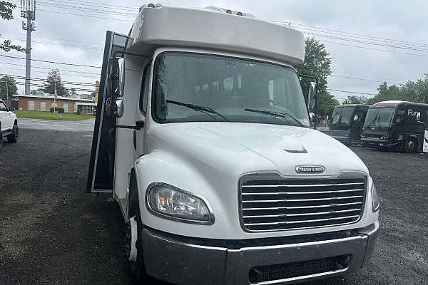 A white truck with black seats and a premium finish for charters