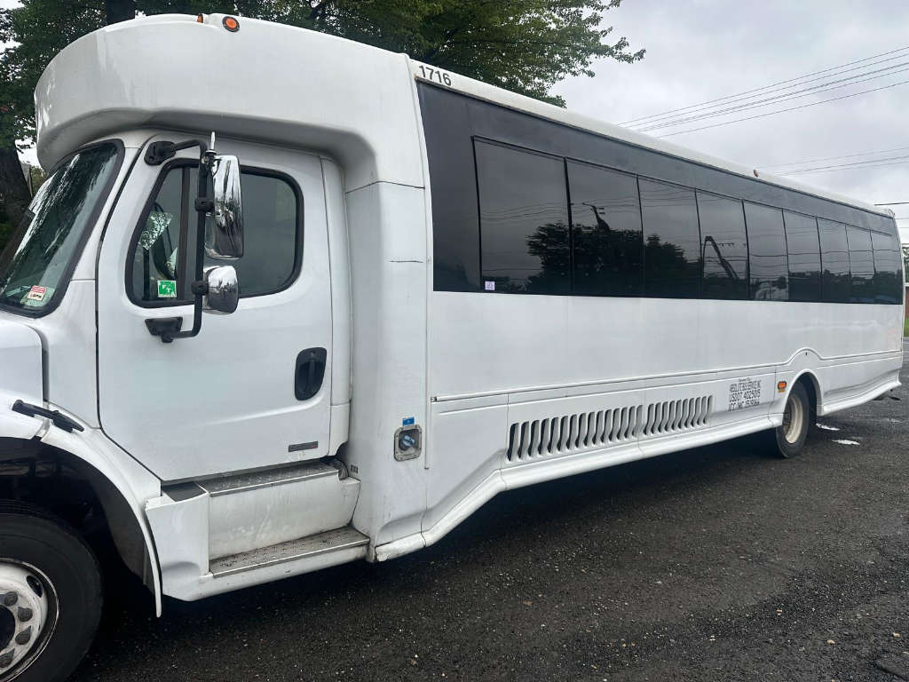 A white bus parked on a Washington, DC roadside