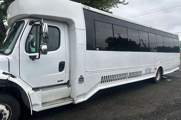 A white bus parked on a Washington, DC roadside