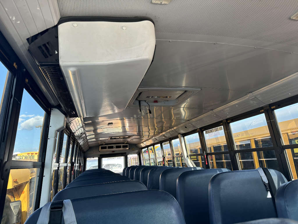 A bus driving down a scenic route for sightseeing tours