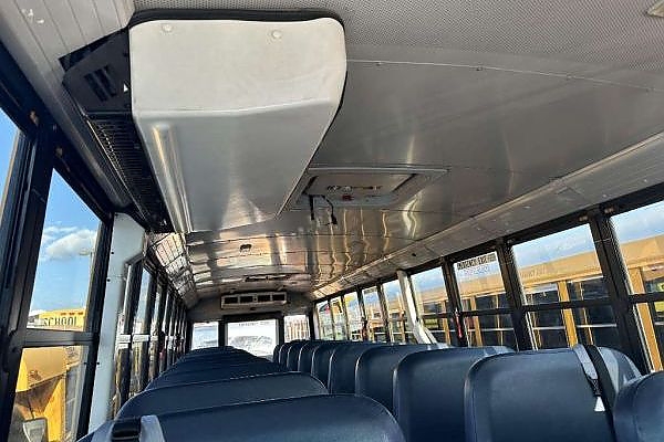 A bus driving down a scenic route for sightseeing tours