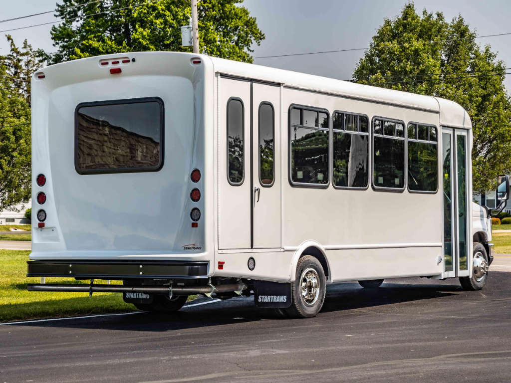 A white bus on a Maryland roadside for corporate travel