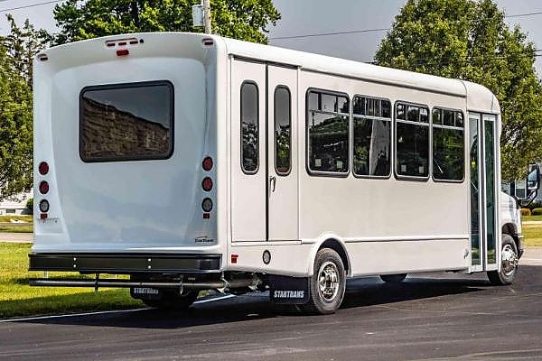 A white bus on a Maryland roadside for corporate travel