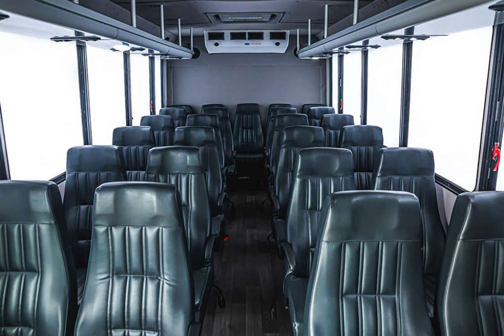 A bus with numerous seats for group transportation